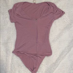 Light pink bodysuit with zipper details